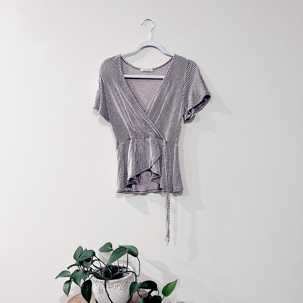 Women’s V-neck baby doll shirt, short sleeve wrap with stripes.